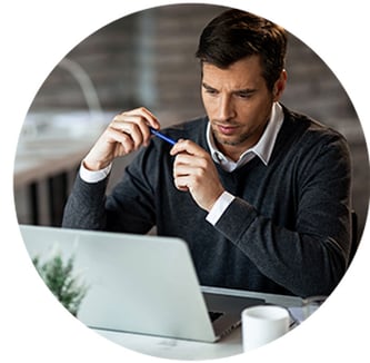 concentrated-businessman-reading-something-computer-while-working-office concentrated-businessman-reading-something-computer-while-working-office
